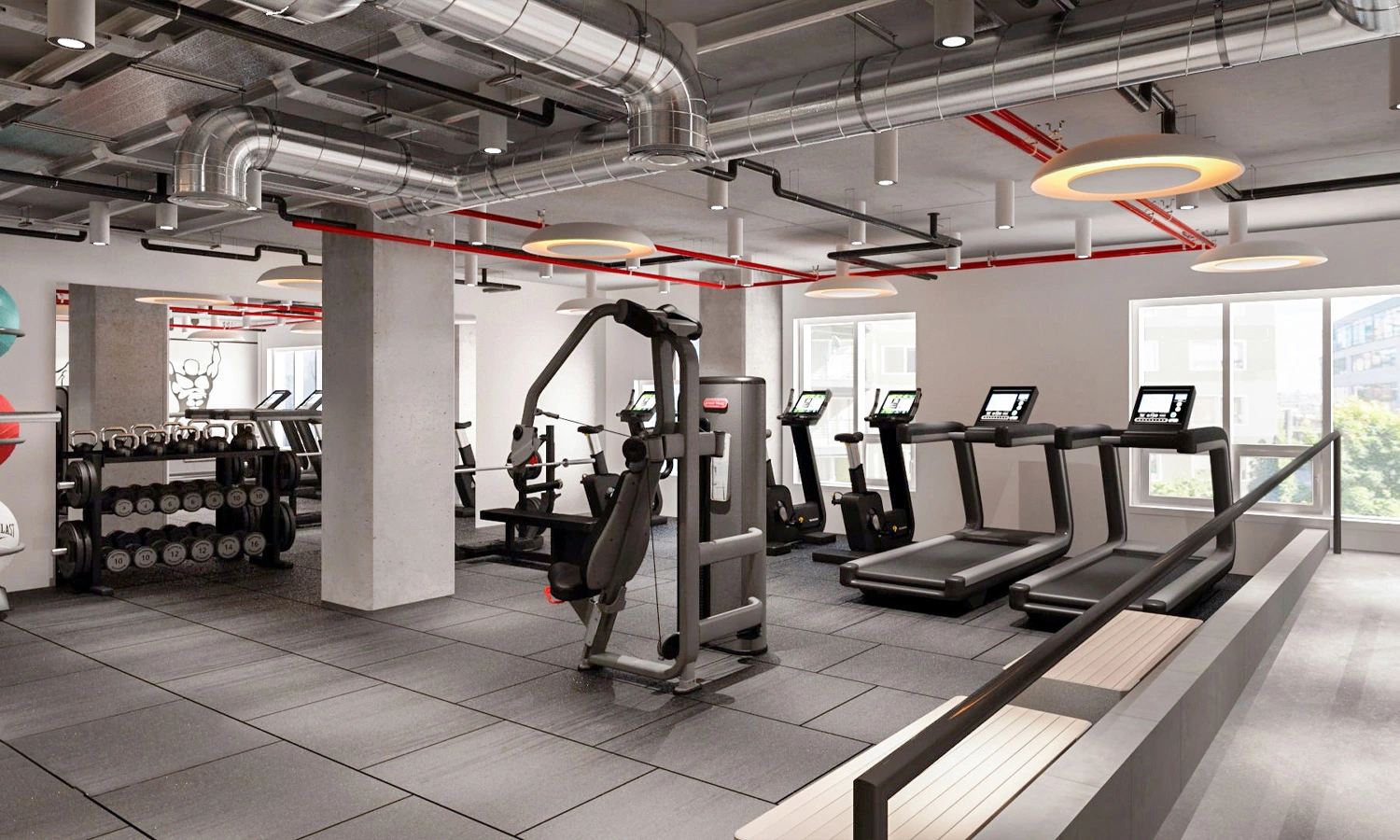 Stylish modern gym interior with functional equipment and abundant natural light.