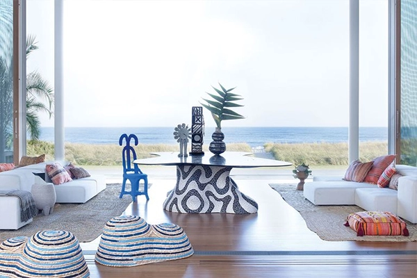 Stylish coastal living room with ocean views and abundant natural light.