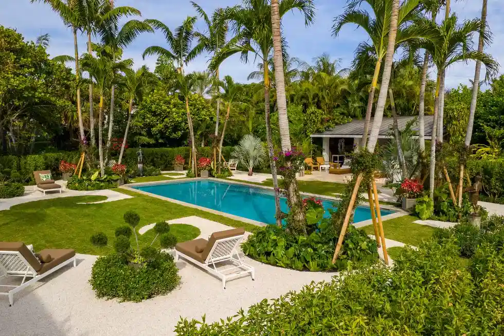 Luxurious backyard getaway with lush gardens for relaxation and outdoor enjoyment.