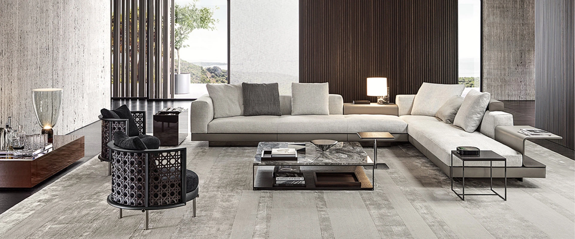 Elegant minimalist living room with a light gray sectional sofa and stylish geometric chairs.