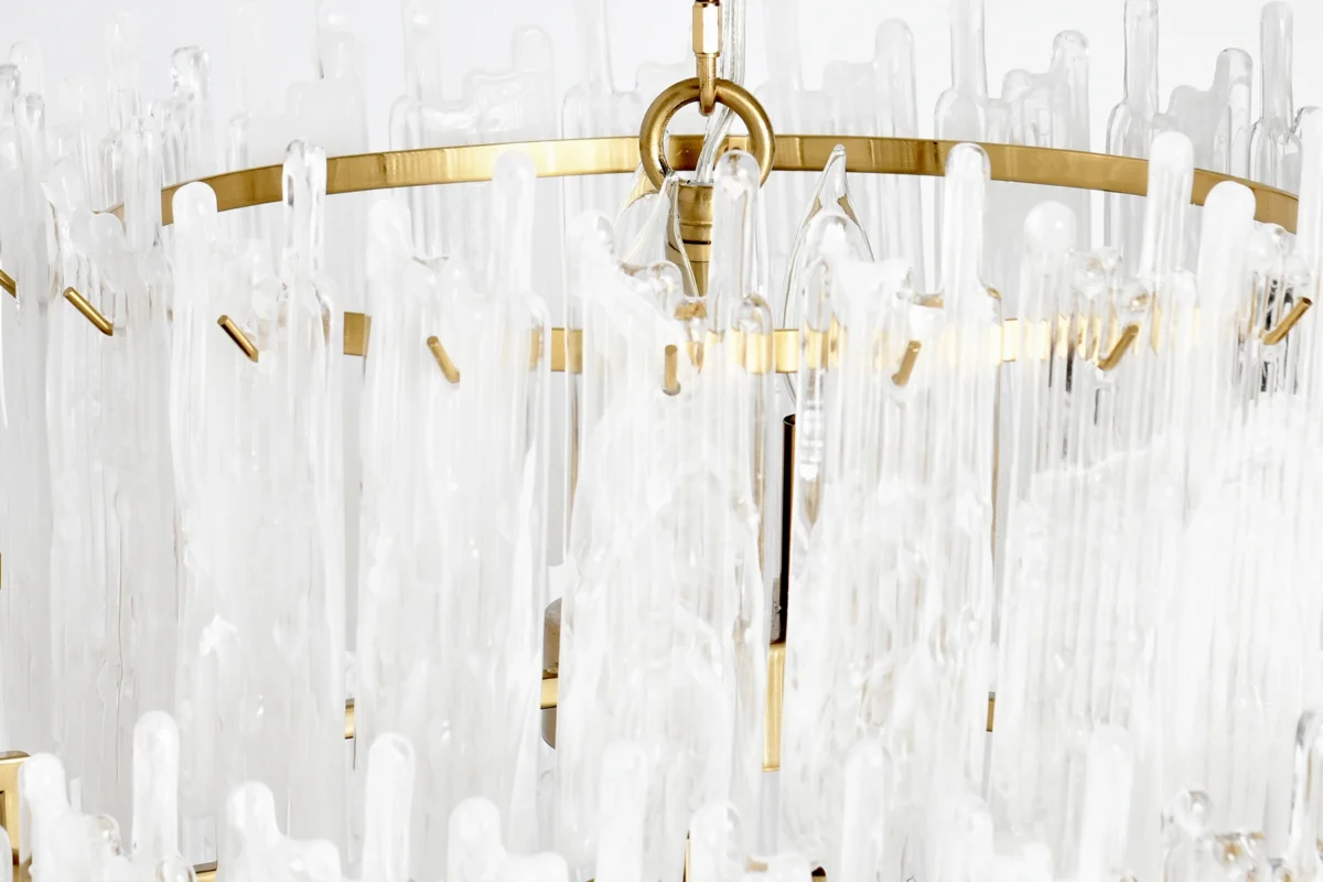 Sophisticated modern chandelier featuring glass accents and a luxurious metal frame for centerpiece lighting.