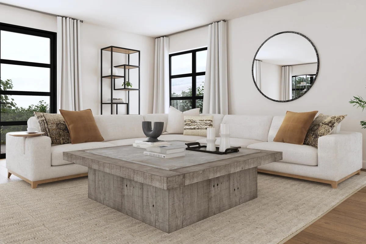 Bright modern living room with plush furniture, natural light, and stylish decor elements.