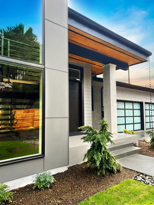 Contemporary residential home featuring glass, concrete, and wood in harmony with nature.