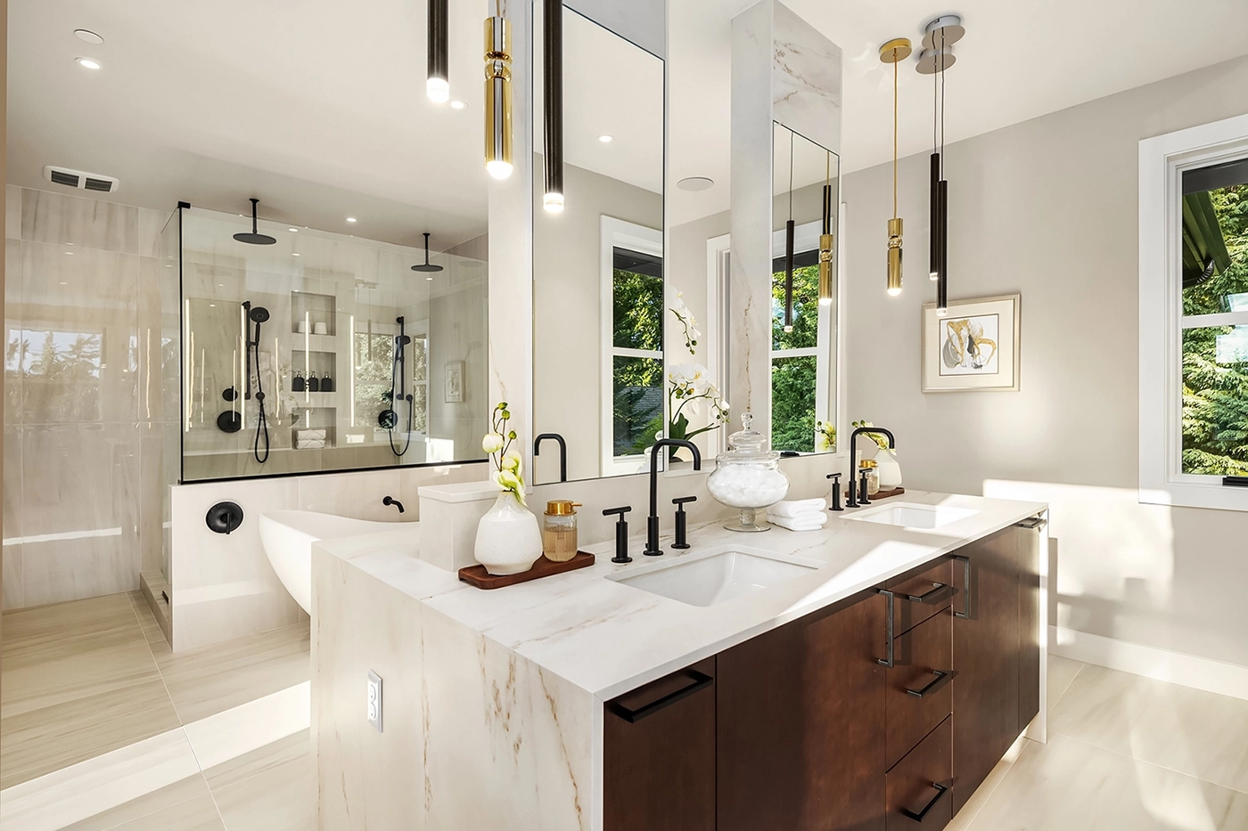 Luxury interior decorator Bellevue spa-inspired bathroom featuring marble countertops, dual vanity, glass shower enclosure, and designer fixtures by Ariana Designs & Interiors for high-end homes.