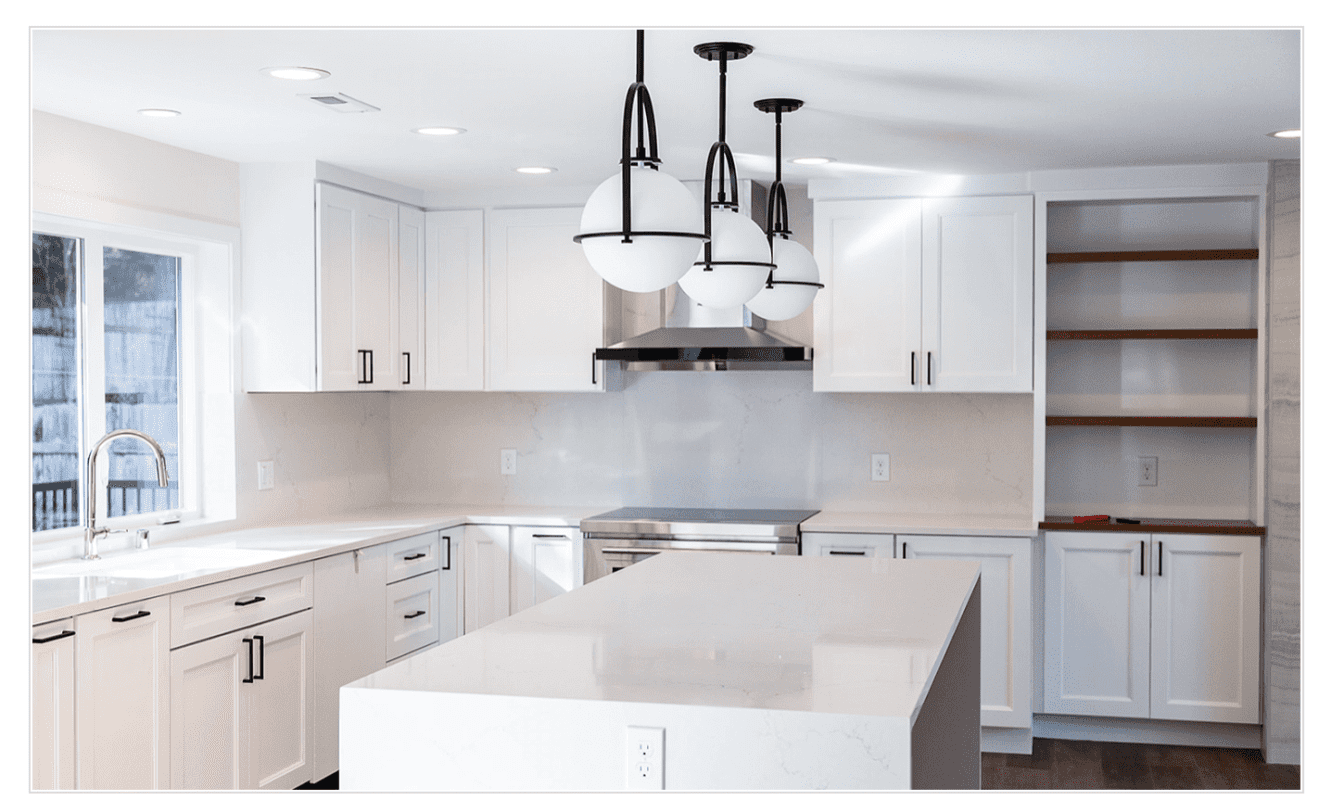 Contemporary white kitchen design with functional layout and stylish pendant lighting.