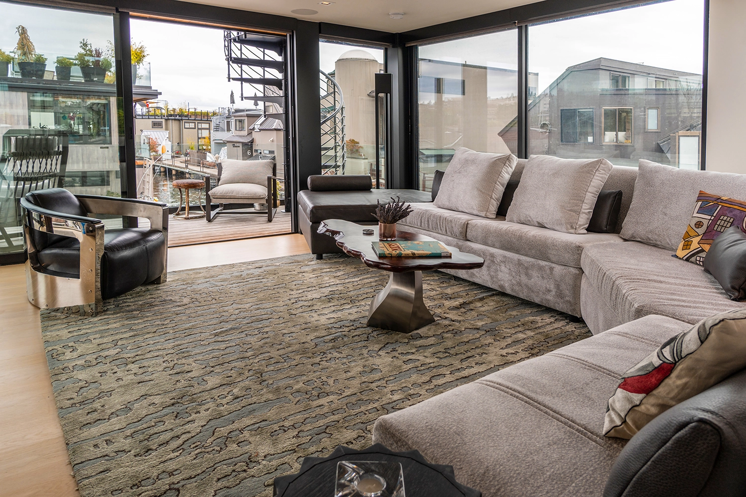 Contemporary living room with panoramic views, stylish furniture, and abundant natural light.