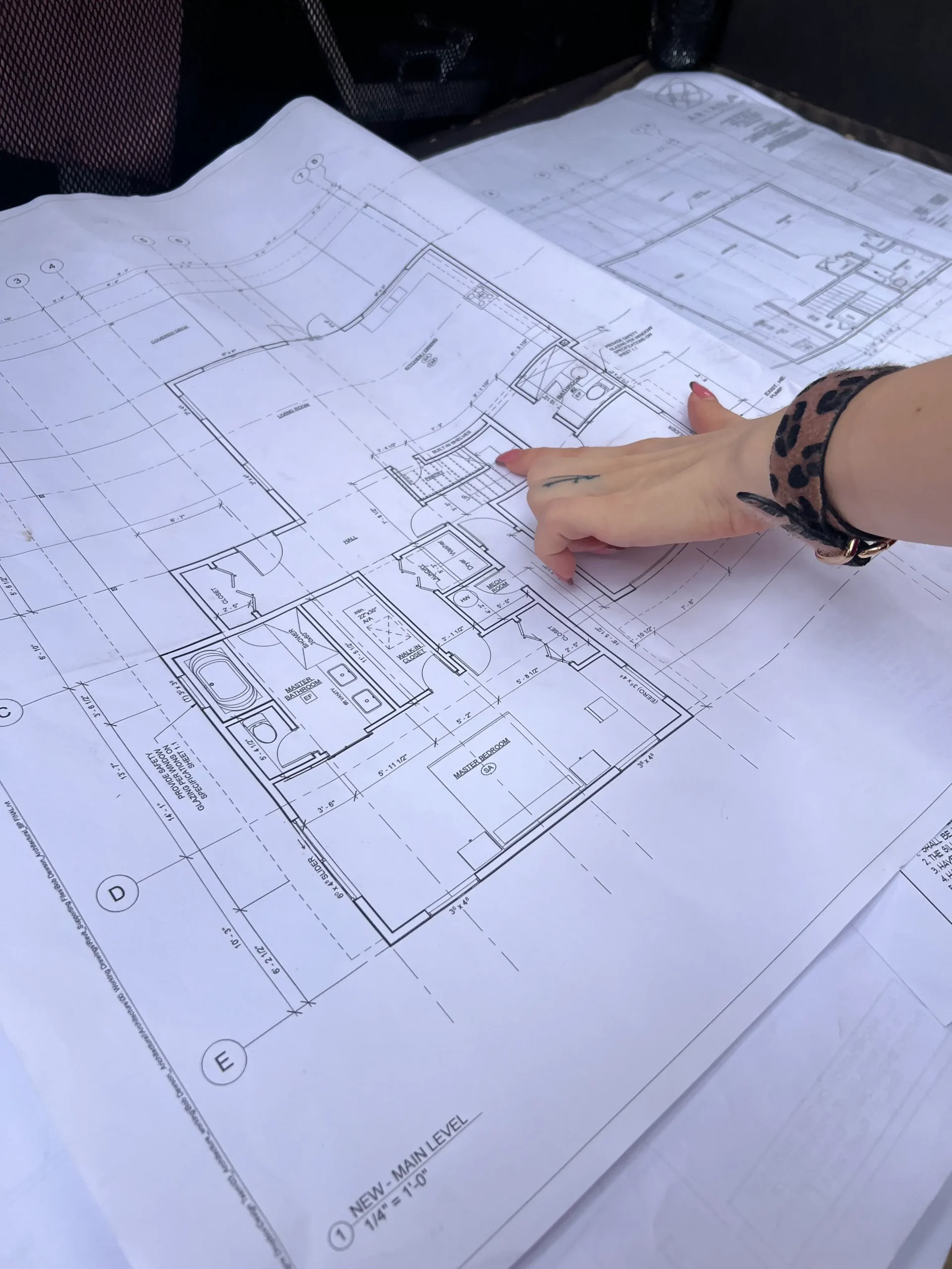 Detailed architectural blueprints showcasing kitchen design and collaborative planning process.