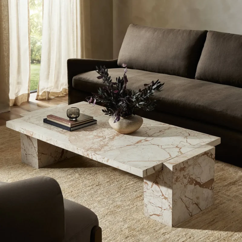 Sophisticated living room with elegant marble coffee table and cozy seating arrangement.