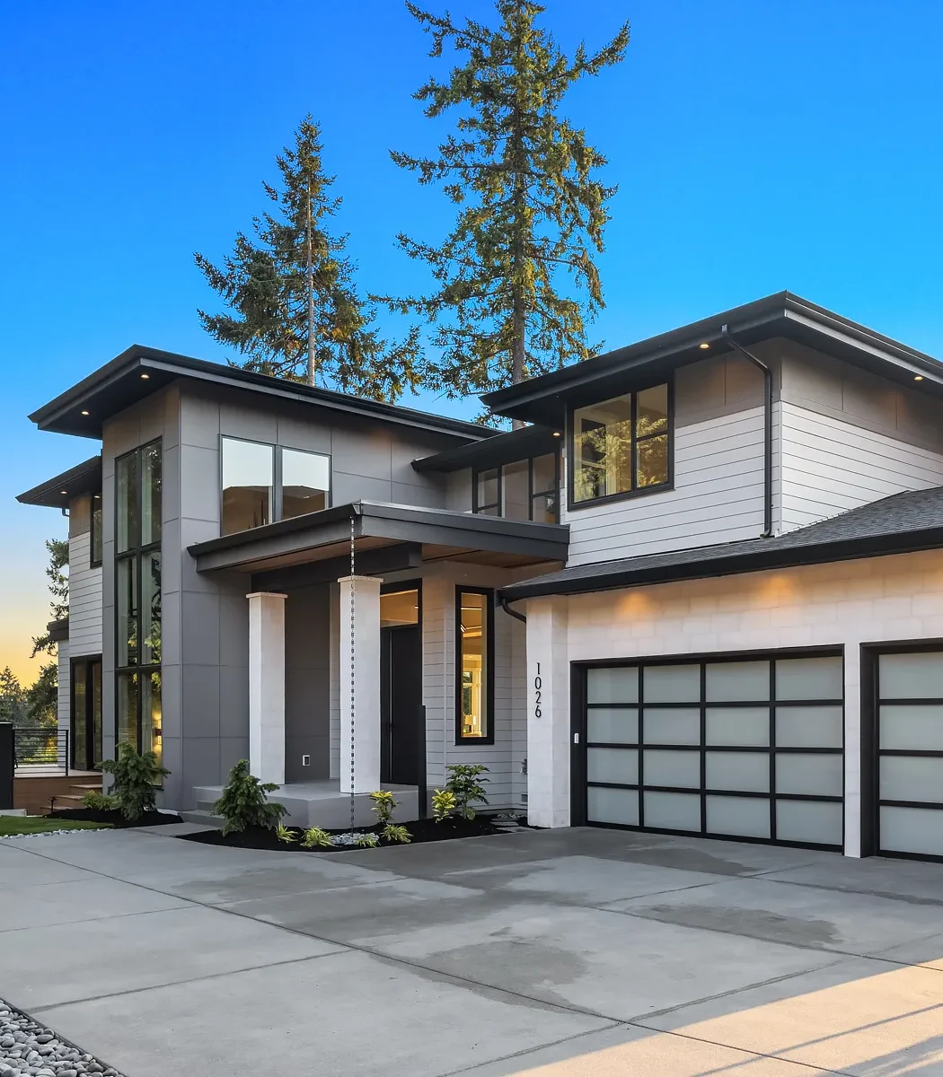 Sleek two-story contemporary home design with natural light and modern materials.