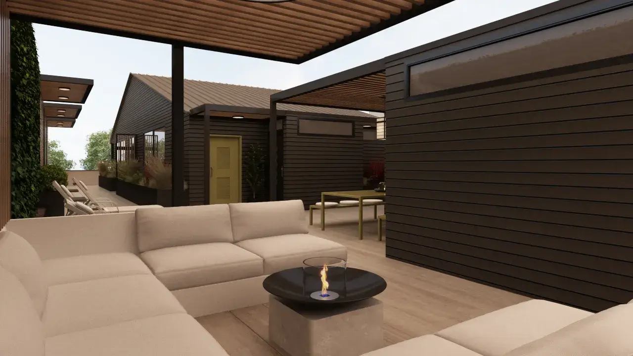 Modern outdoor living space with plush sectional sofa, cozy fire table, and vibrant greenery.