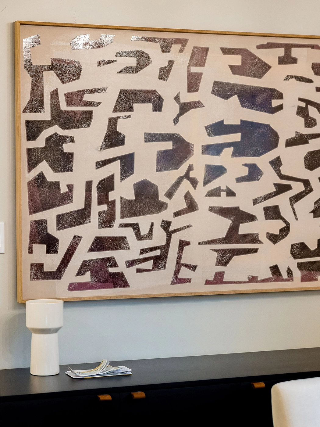 Abstract metallic artwork with intricate shapes enhancing modern interior decor elegance.