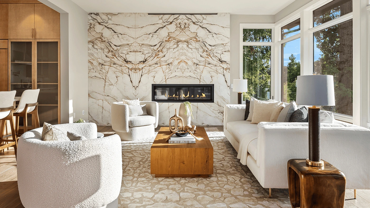 Modern elegant living room with marble accents, cozy seating, and a stylish dining area.