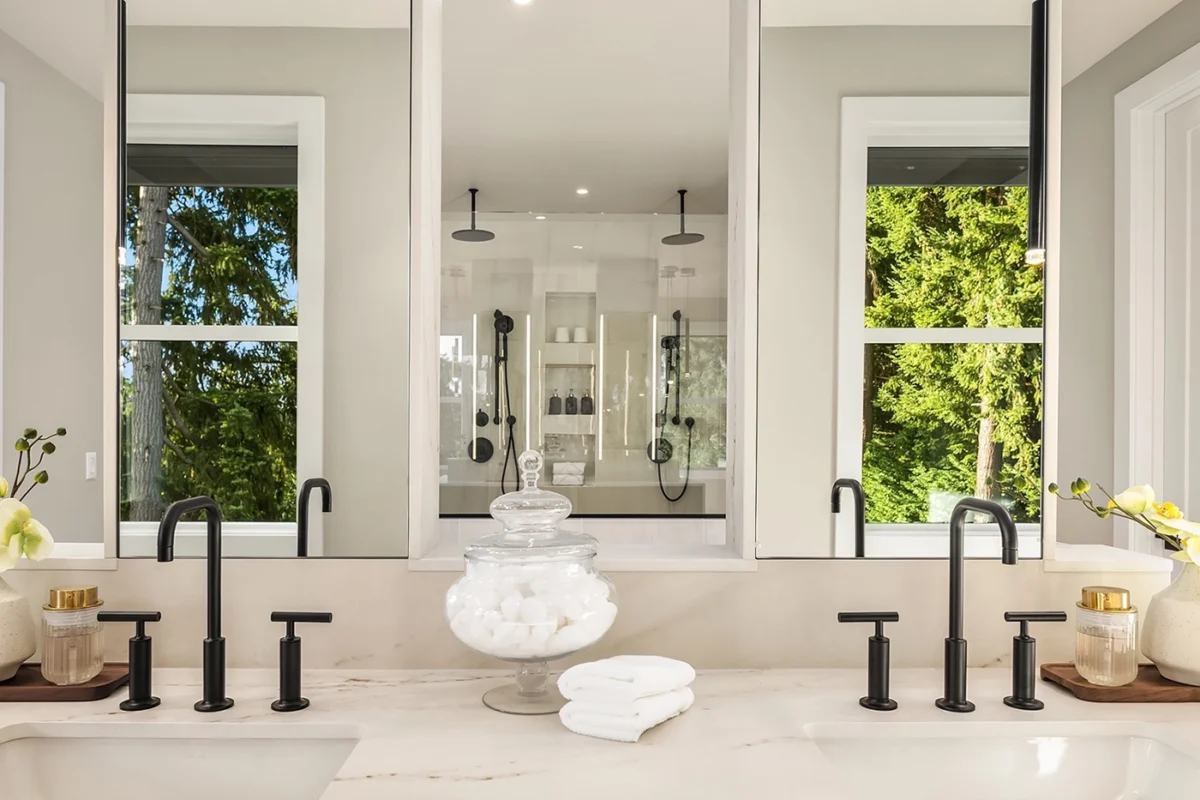 Elegant modern bathroom design with marble countertops, sleek fixtures, and serene natural elements.