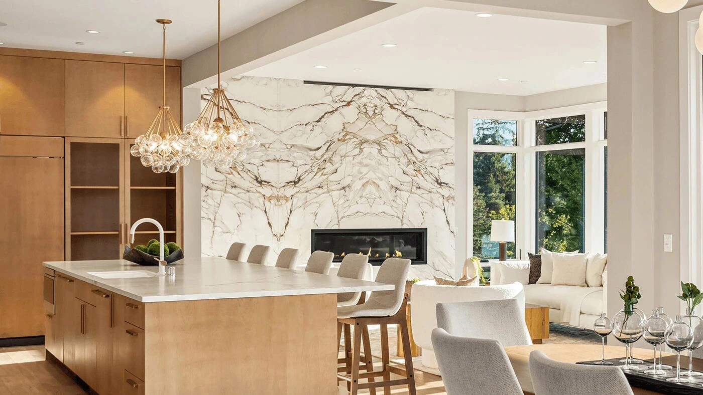 Modern kitchen and living area featuring elegant design, natural light, and luxurious finishes.