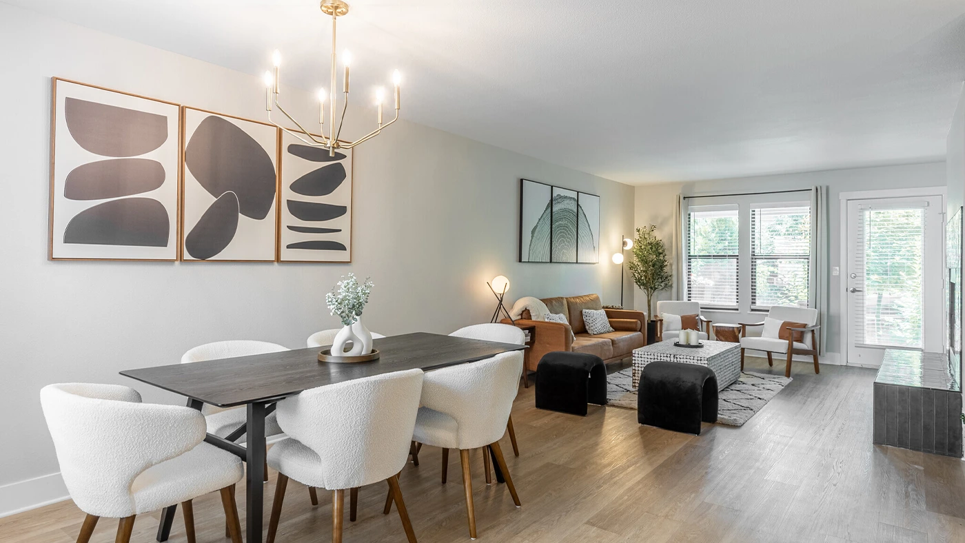 Stylish modern living and dining area with elegant decor and natural light.