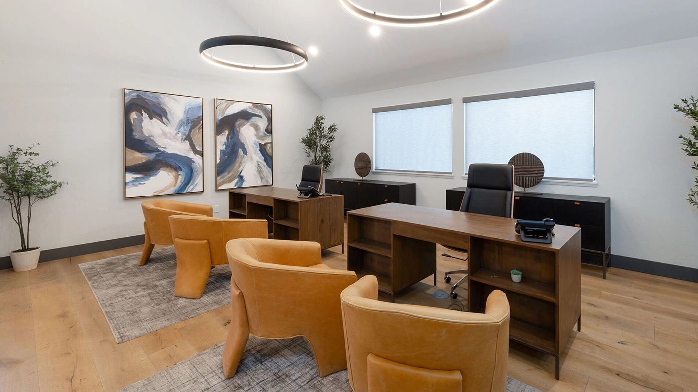 Elegant modern office space with abstract art, ergonomic furniture, and natural lighting.