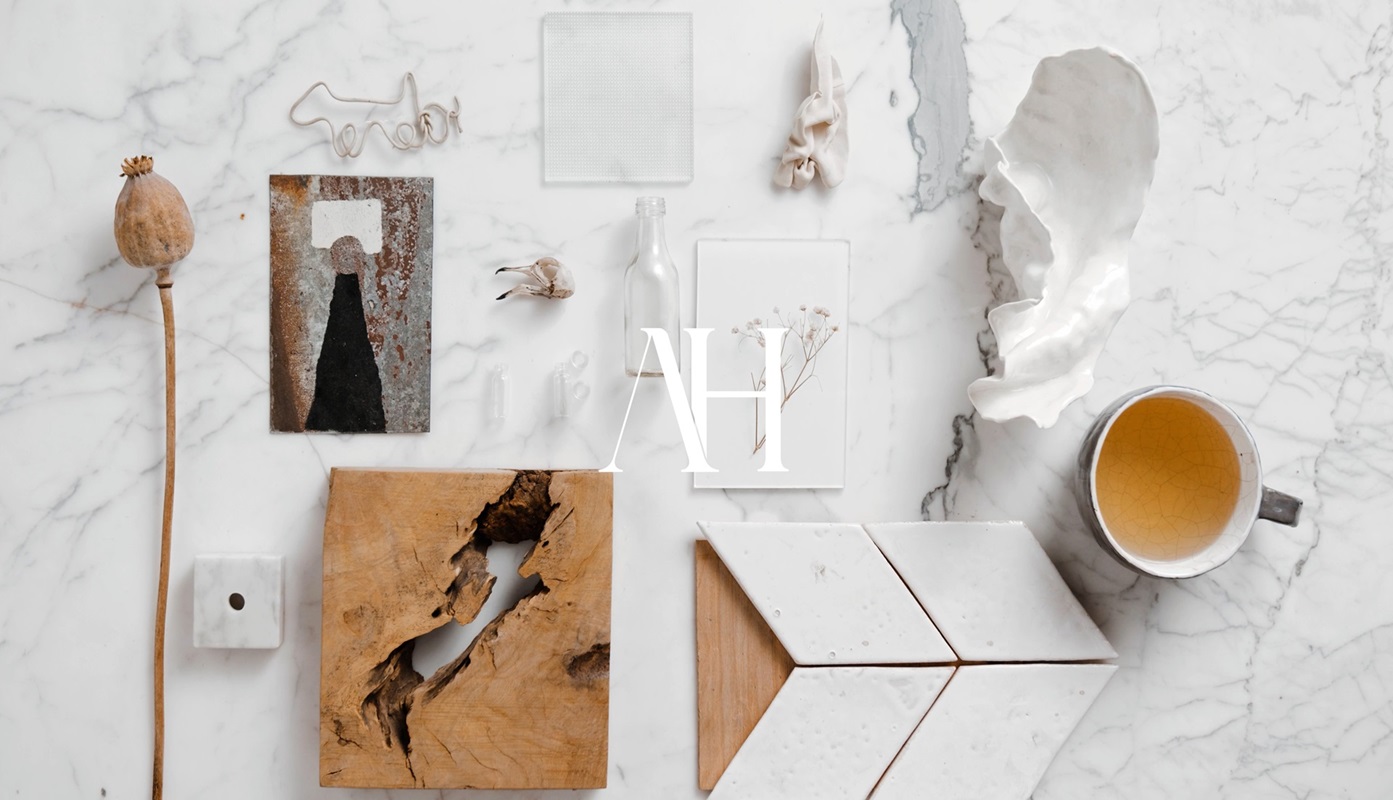 Elegant flat lay of organic and geometric objects on polished marble background.