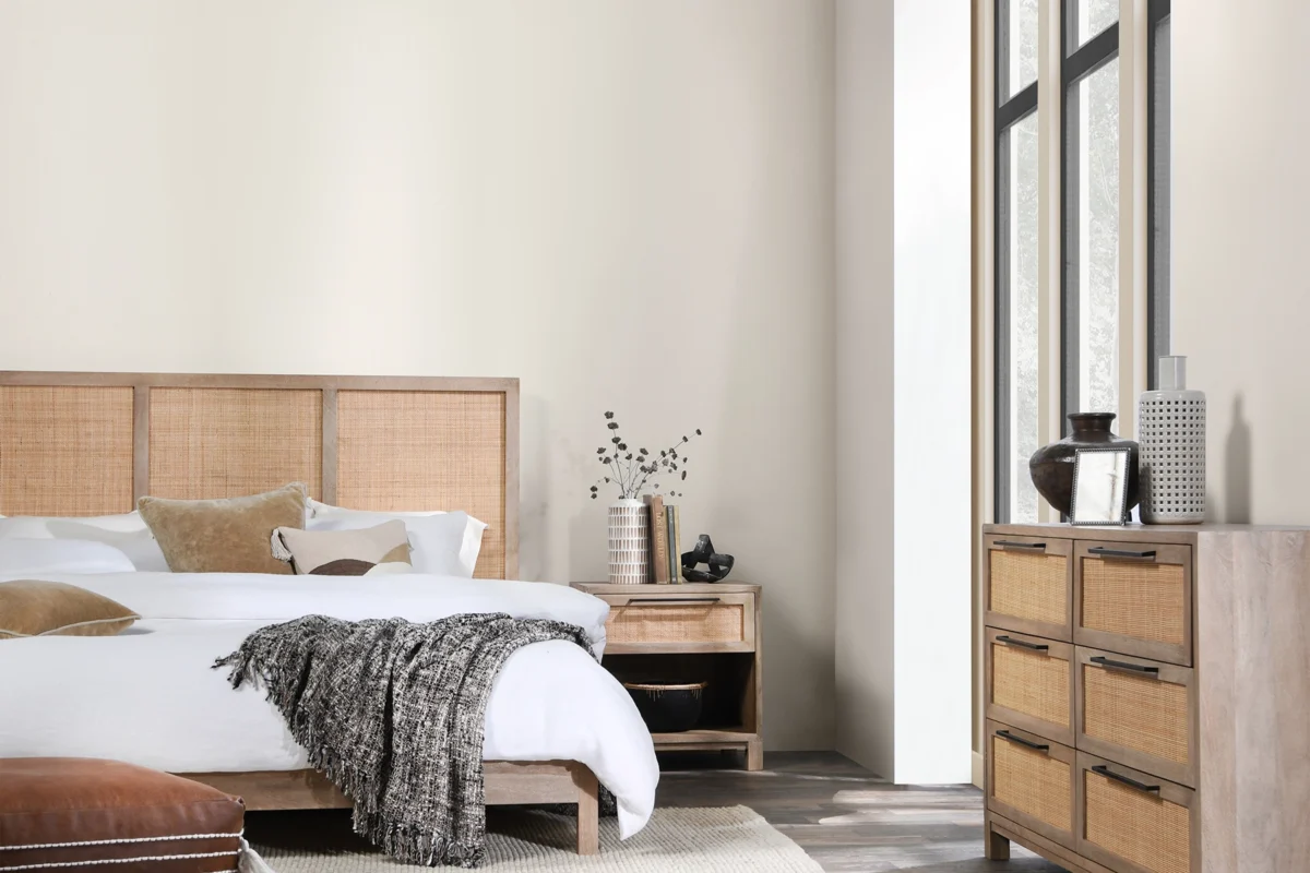 A cozy and inviting bedroom created by interior designer Bellevue WA, Ariana Adireh Anderson, showcasing elegant textiles.