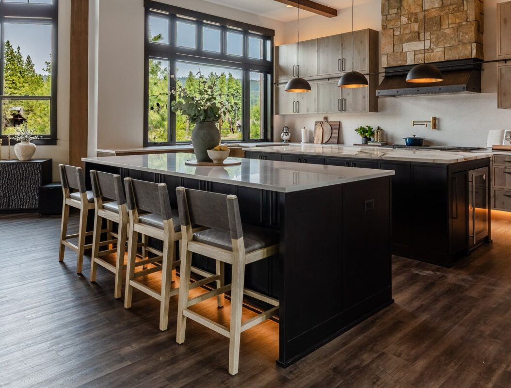 Stylish modern kitchen with a sleek island, warm wood accents, and abundant natural light.