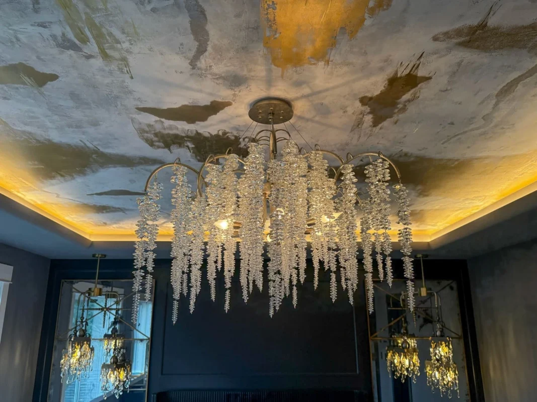 Elegant chandelier enhances luxurious interior design with stunning crystal accents and ambient lighting.
