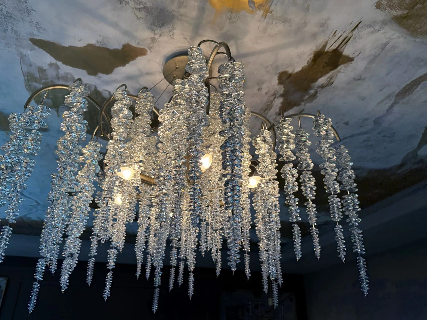 Stunning crystal chandelier adds elegance and sparkle to a stylish interior space.