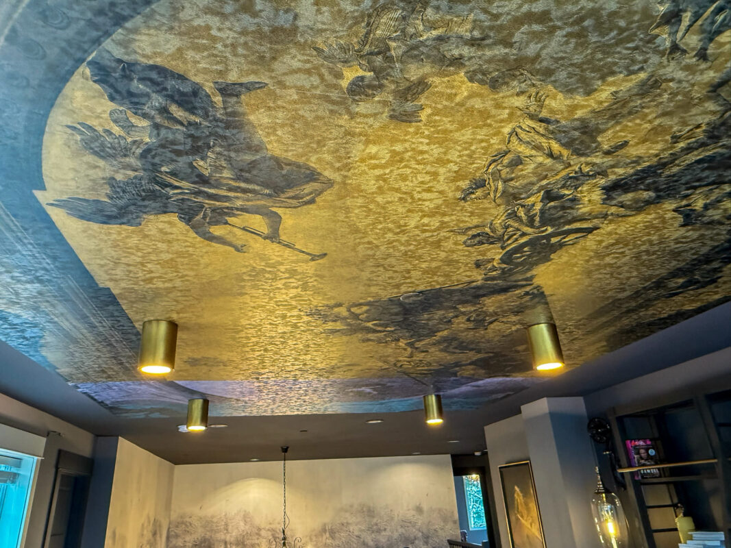 Stylish luxury ceiling design featuring intricate mural and modern lighting for elegant interiors.