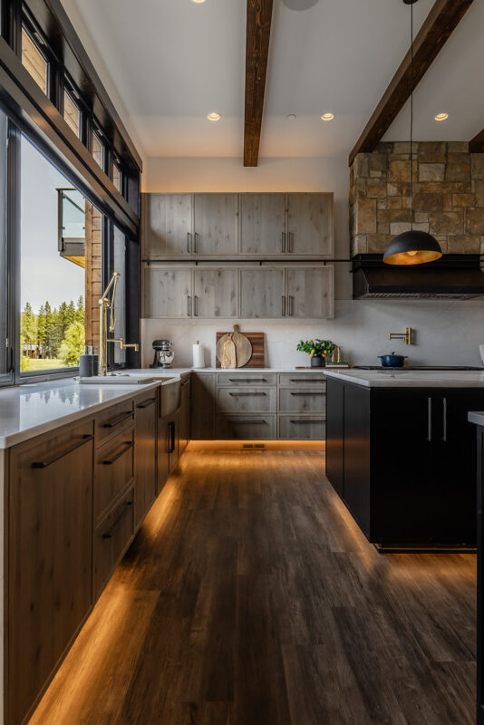 Refined kitchen perspective highlighting symmetry, rich textures, and craftsmanship in a contemporary Pacific Northwest vacation home.
