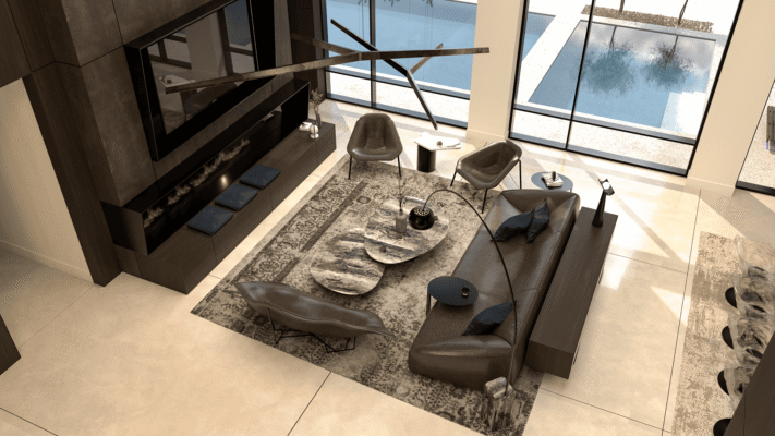 Aerial view of a contemporary lounge with stone coffee tables, tailored seating, and full-height windows overlooking a pool.