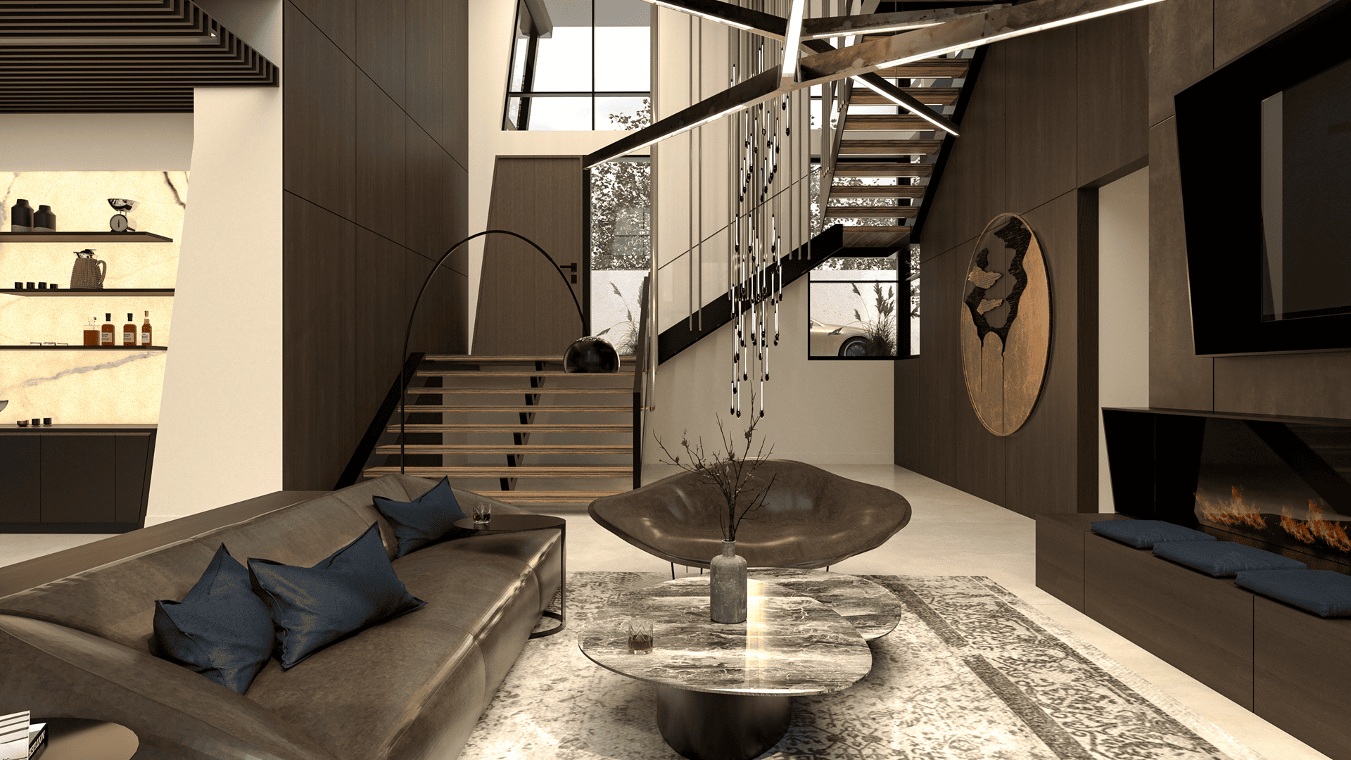 Modern waterfront lounge featuring a linear fireplace wall, sculptural ceiling lights, custom sofa, and a circular bronze art piece beside an open-riser staircase.